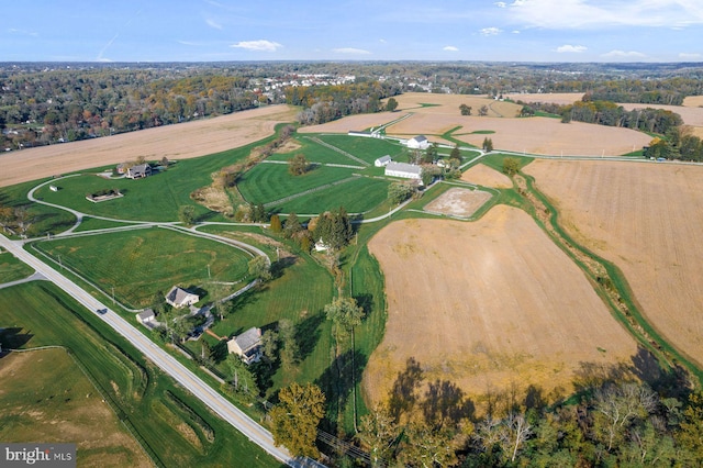 birds eye view of property with a rural view