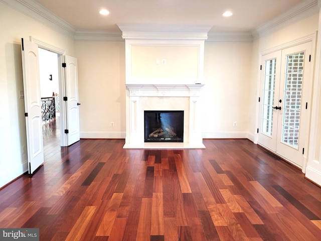 unfurnished living room featuring crown molding, dark wood-type flooring, and french doors