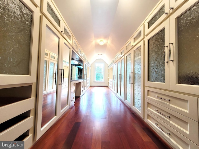 corridor featuring french doors, dark hardwood / wood-style flooring, and vaulted ceiling