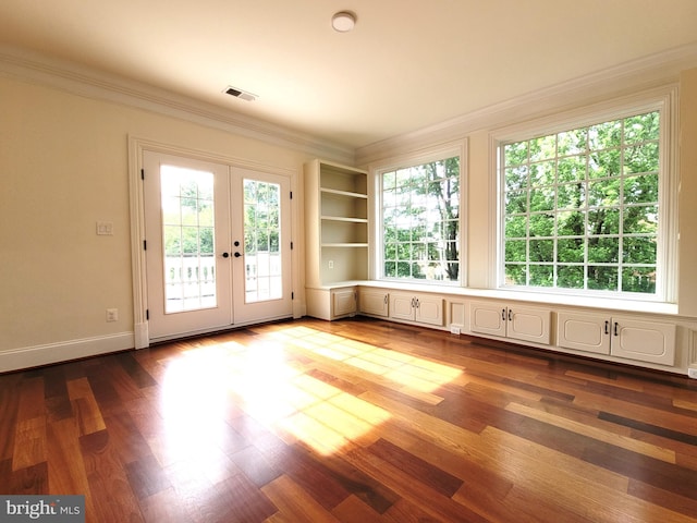 interior space with hardwood / wood-style flooring, plenty of natural light, and crown molding