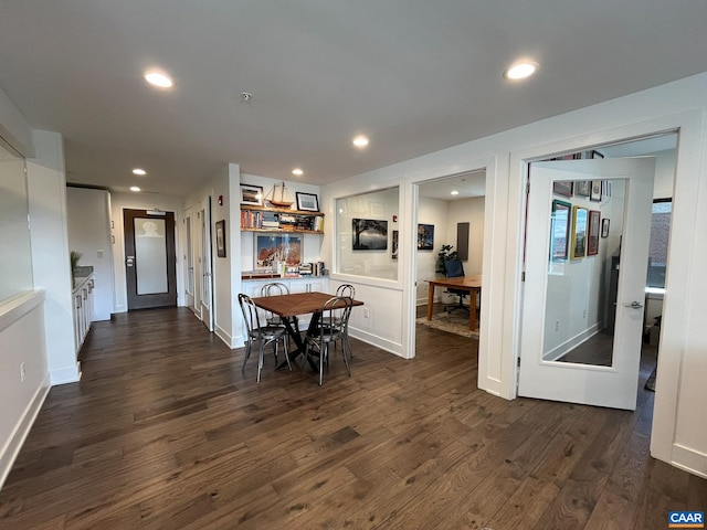 dining room with dark hardwood / wood-style floors