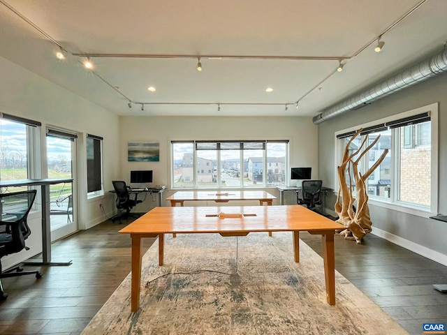 office area featuring plenty of natural light and dark hardwood / wood-style flooring