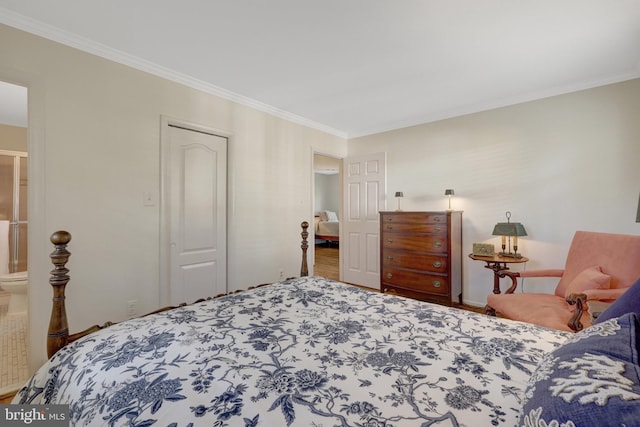 bedroom with ornamental molding, a closet, and wood finished floors