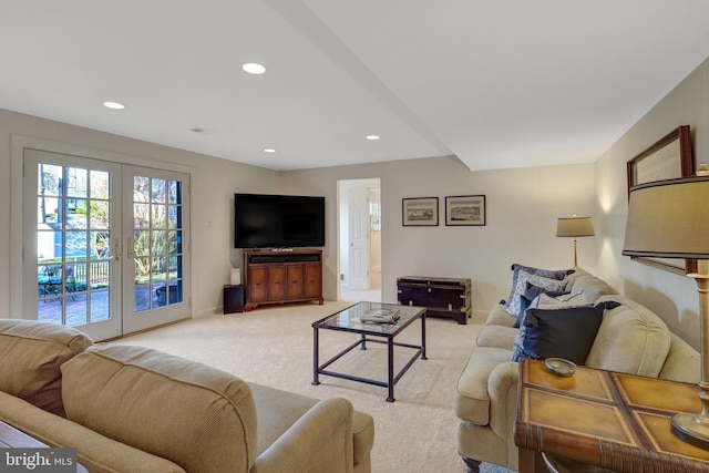 living room with recessed lighting, baseboards, light colored carpet, and french doors