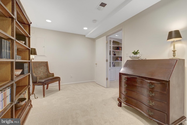 living area with built in shelves, recessed lighting, light colored carpet, visible vents, and baseboards