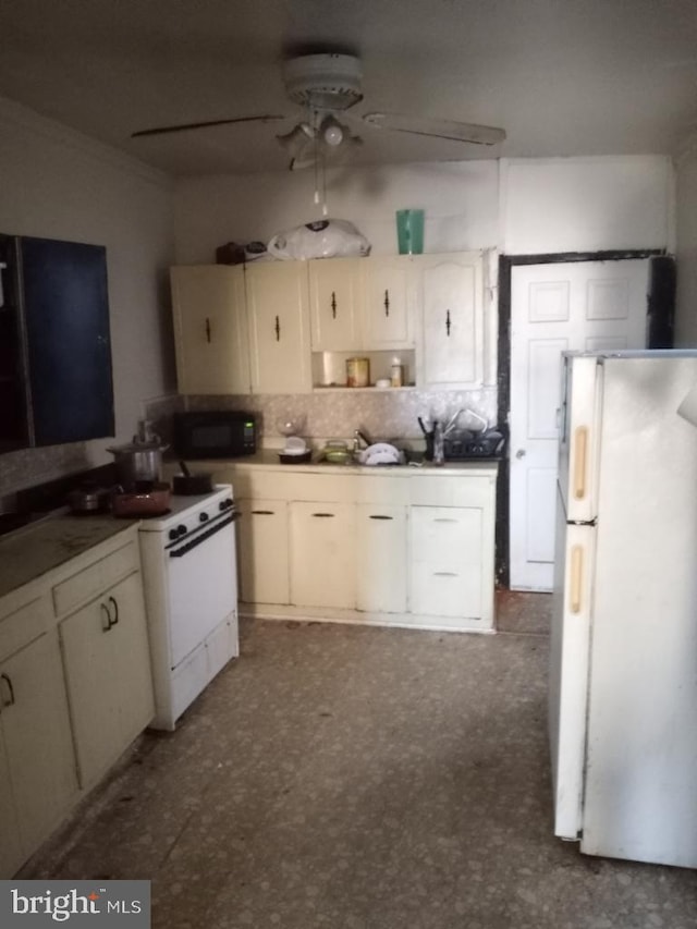 kitchen featuring ceiling fan, white cabinets, white appliances, backsplash, and dark tile flooring