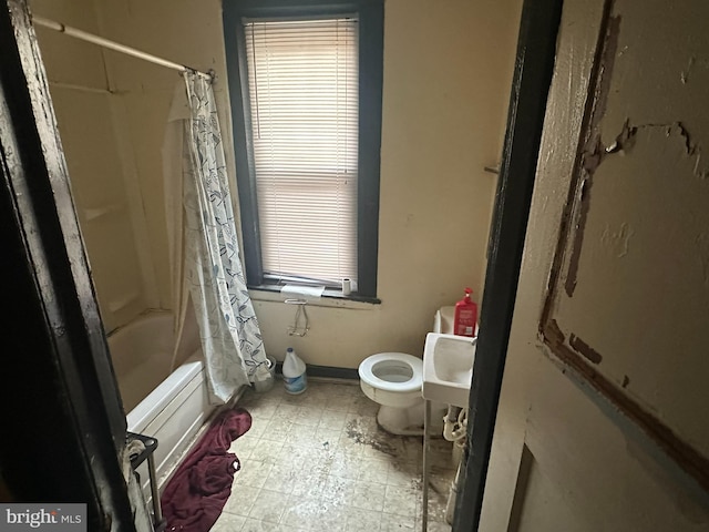 full bathroom with shower / tub combo, toilet, tile floors, and sink