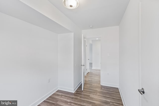 unfurnished room with wood-type flooring