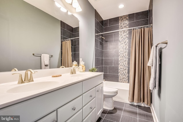 full bathroom with shower / tub combo with curtain, dual bowl vanity, toilet, and tile flooring