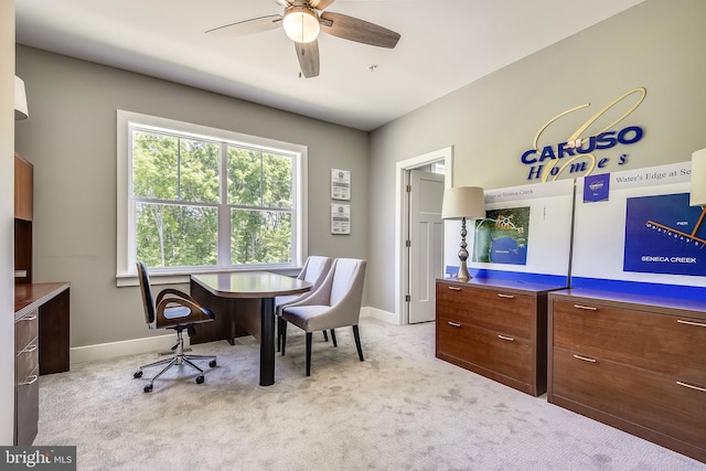 office area with ceiling fan and light carpet