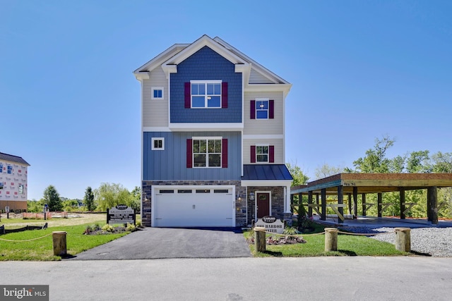 view of front of property featuring a garage and a front lawn