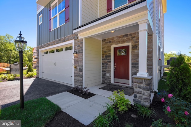 doorway to property featuring a garage