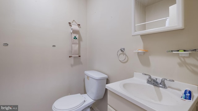 bathroom featuring toilet and large vanity