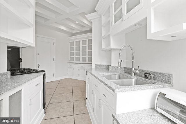 kitchen featuring white cabinets and light tile floors