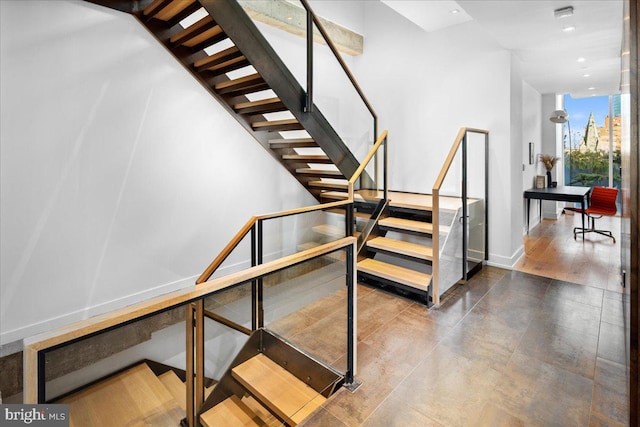 staircase featuring hardwood / wood-style flooring