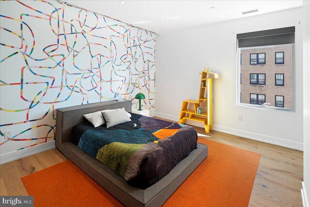 bedroom with wood-type flooring