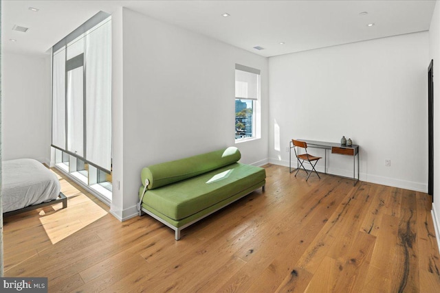 living area with hardwood / wood-style floors