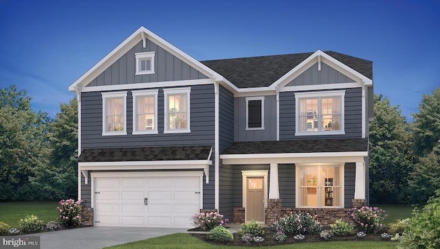 craftsman inspired home with a garage and a front lawn