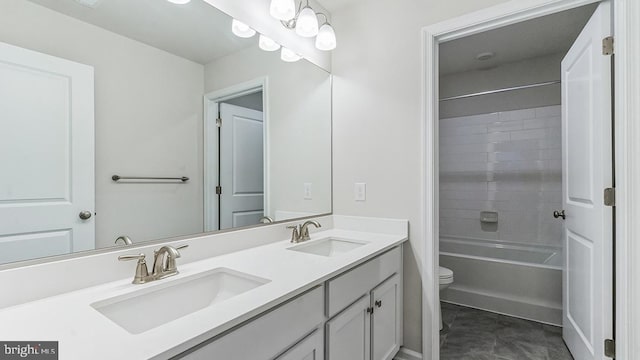 full bathroom featuring vanity, toilet, and tiled shower / bath