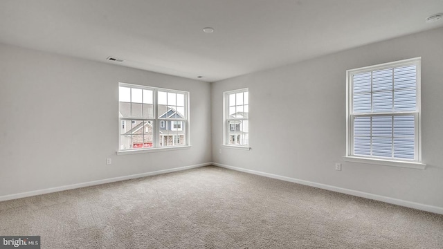 spare room featuring carpet flooring