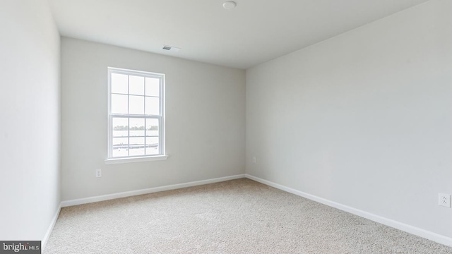 unfurnished room featuring carpet