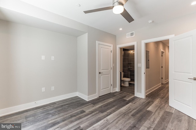 empty room with ceiling fan and dark hardwood / wood-style floors