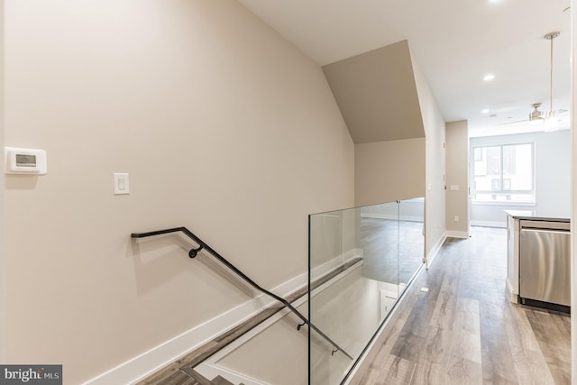 corridor with light hardwood / wood-style floors