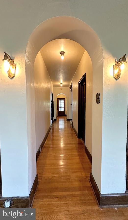 hallway featuring hardwood / wood-style flooring