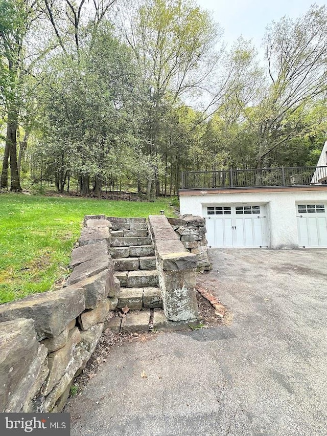 garage featuring a lawn