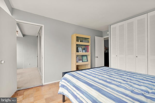 carpeted bedroom with a closet