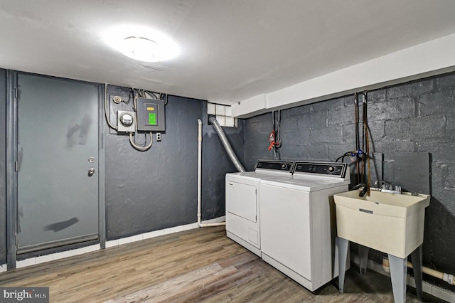 laundry area featuring washer hookup, hardwood / wood-style floors, and washer and dryer