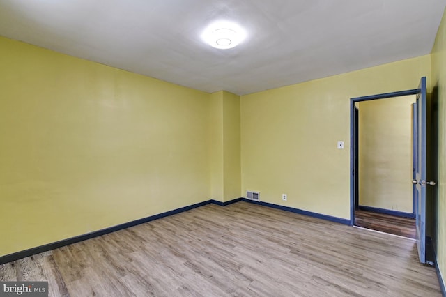 unfurnished room featuring wood-type flooring