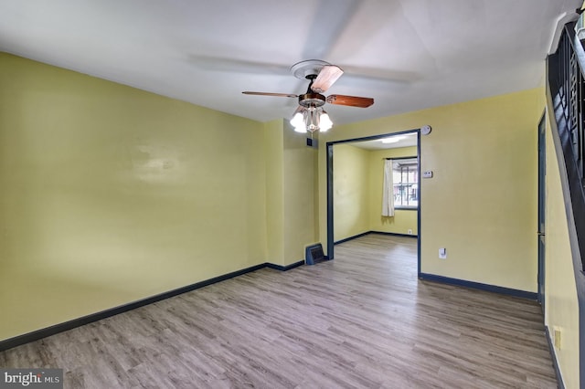 unfurnished room featuring wood-type flooring and ceiling fan