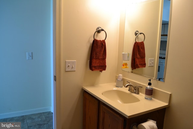 bathroom featuring tile flooring and vanity