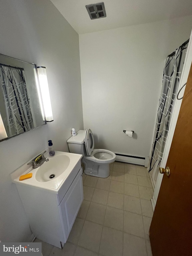 bathroom with toilet, tile flooring, vanity, and a baseboard radiator