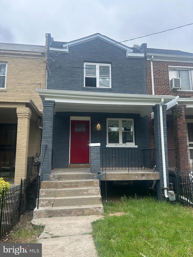 view of property with covered porch