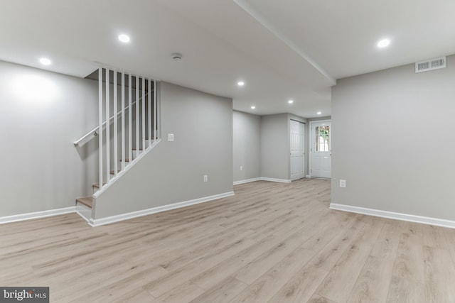 unfurnished room with light hardwood / wood-style floors