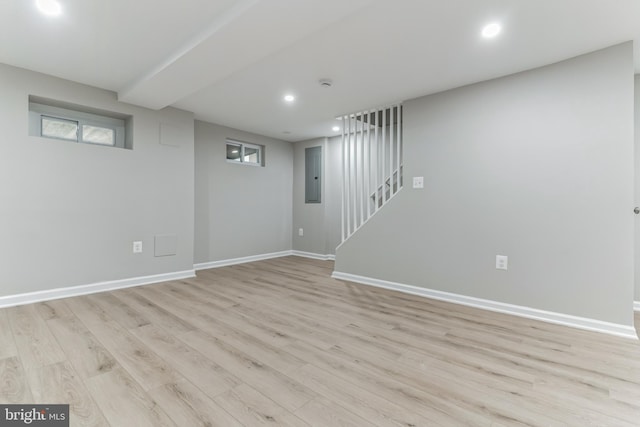 basement featuring light wood-type flooring