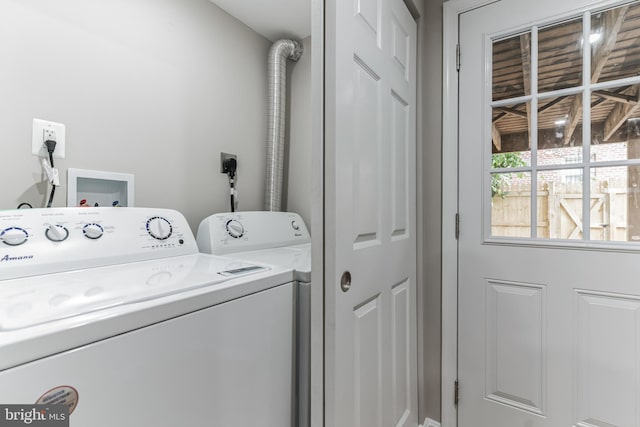 clothes washing area featuring hookup for a washing machine, washer and dryer, and hookup for an electric dryer