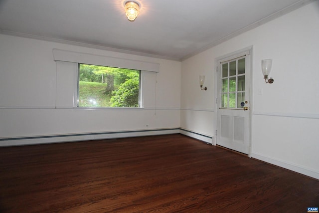 empty room featuring ornamental molding, dark hardwood / wood-style floors, and a baseboard heating unit