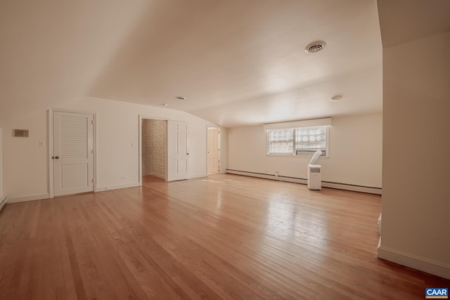 interior space featuring light hardwood / wood-style flooring and vaulted ceiling