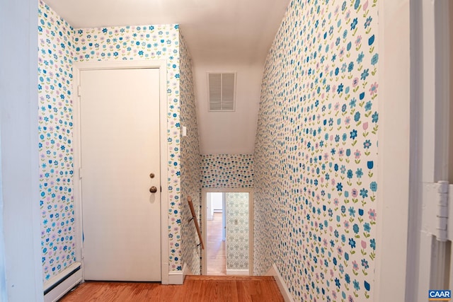 interior space featuring light hardwood / wood-style floors and baseboard heating