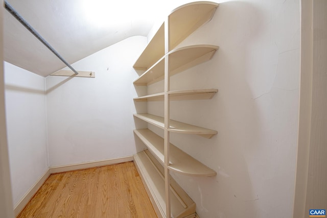 walk in closet featuring hardwood / wood-style flooring