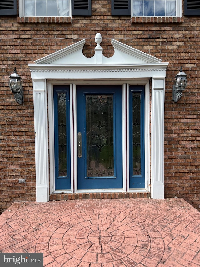 doorway to property featuring a patio