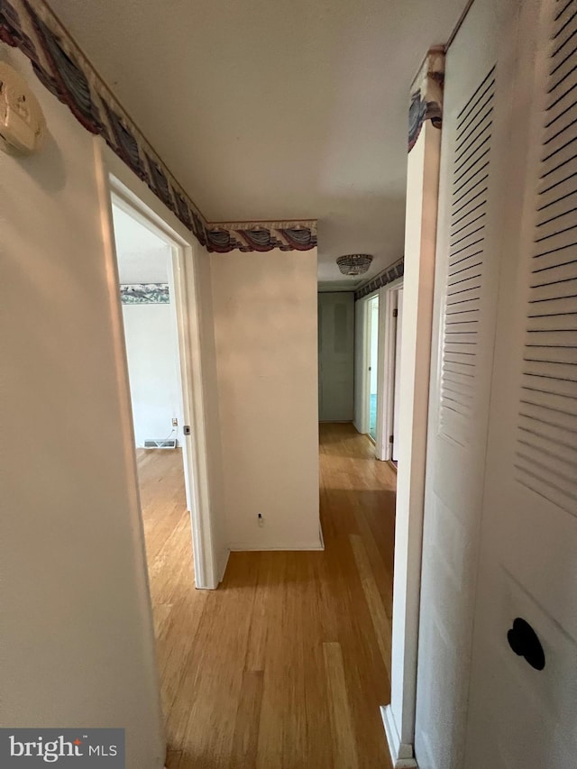 hallway with light wood-type flooring