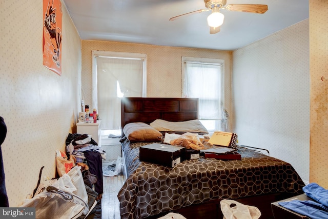 bedroom featuring wood-type flooring and ceiling fan