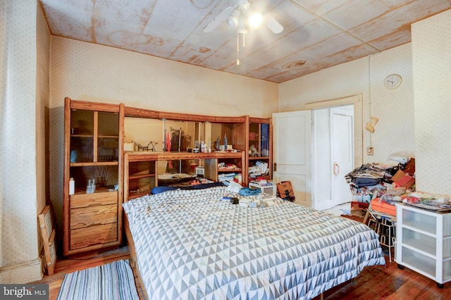 bedroom featuring ceiling fan and hardwood / wood-style floors