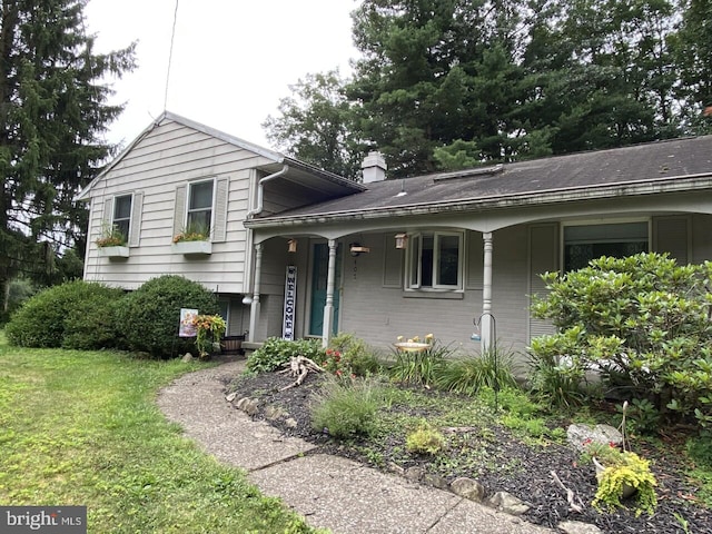 split level home featuring covered porch