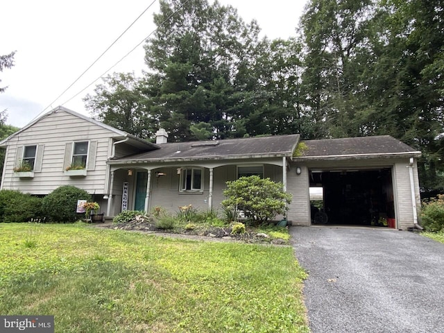 split level home featuring a garage and a front yard