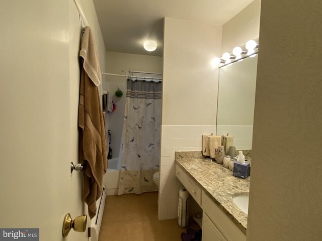 full bathroom featuring shower / bath combination with curtain, tile patterned flooring, toilet, vanity, and baseboard heating